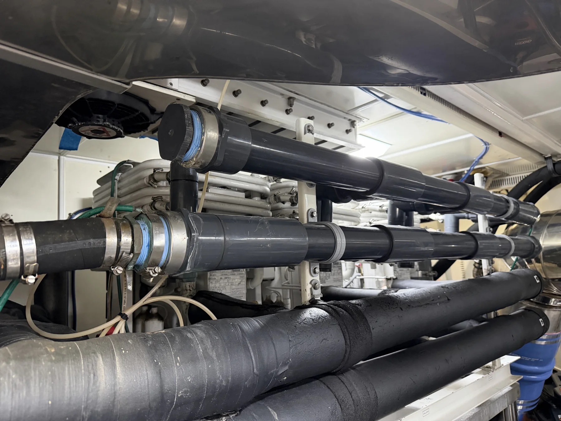 Insulated marine chilled-water piping and manifold connections inside a machinery space
